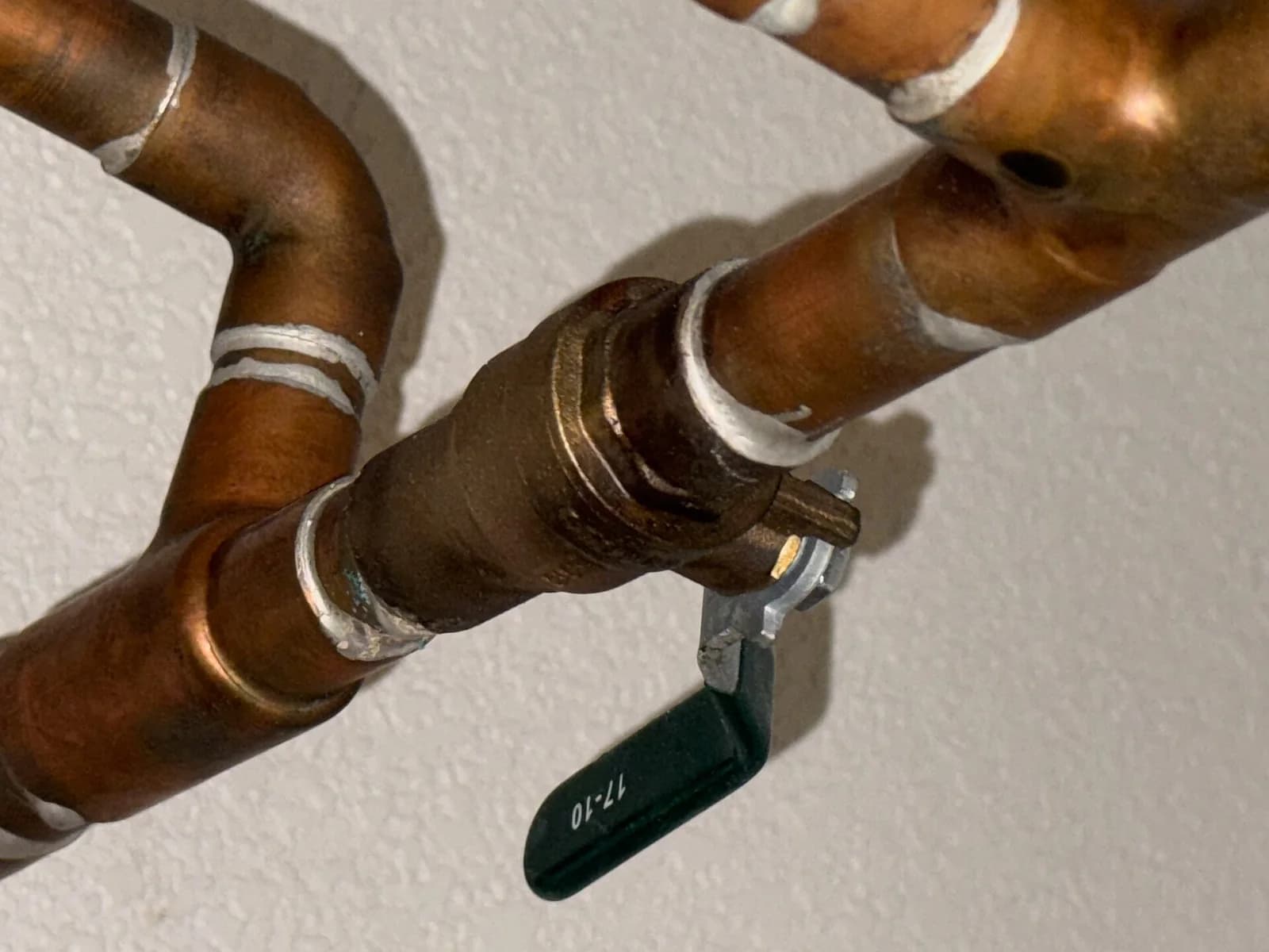 Copper water pipes with a main water line shutoff valve